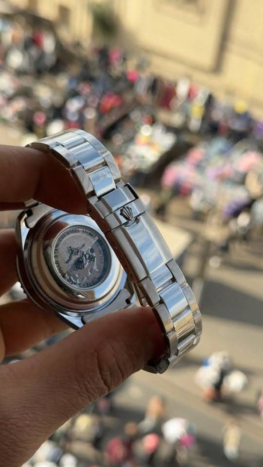 GMT-style metal watch case back detail