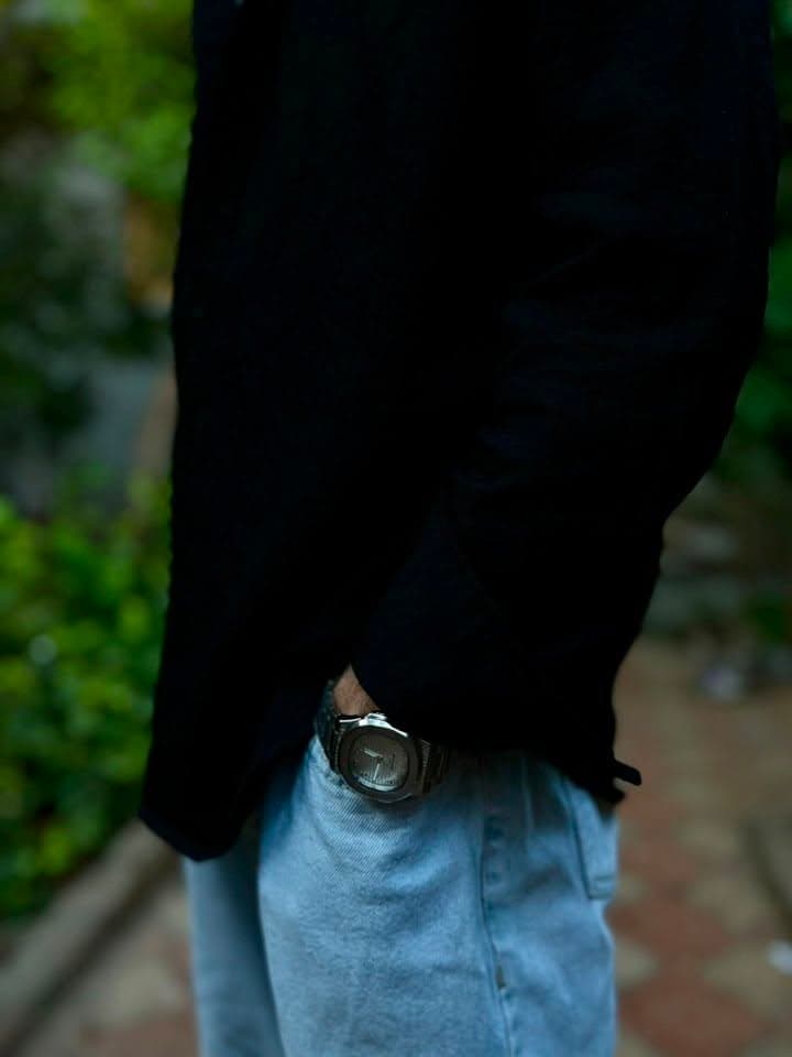 Silver dial metal watch lifestyle view