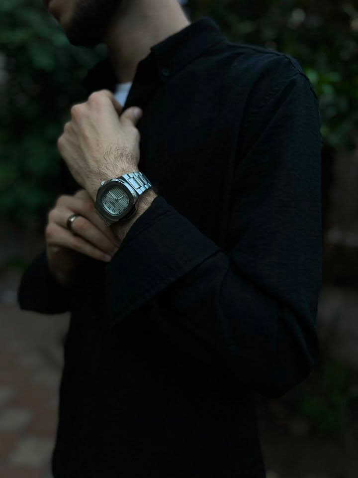 White dial metal watch portrait lifestyle view
